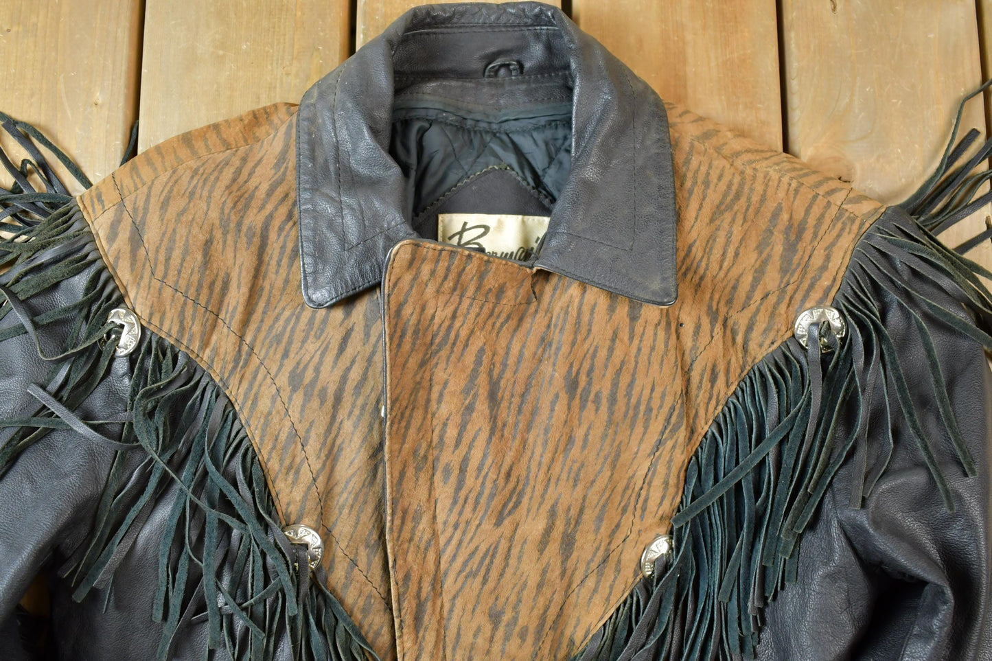 Vintage 1990s Bermans Leather Frills Tassel Animal Print Wild Print Motorcycle Jacket Made In USA from propervintagecanada