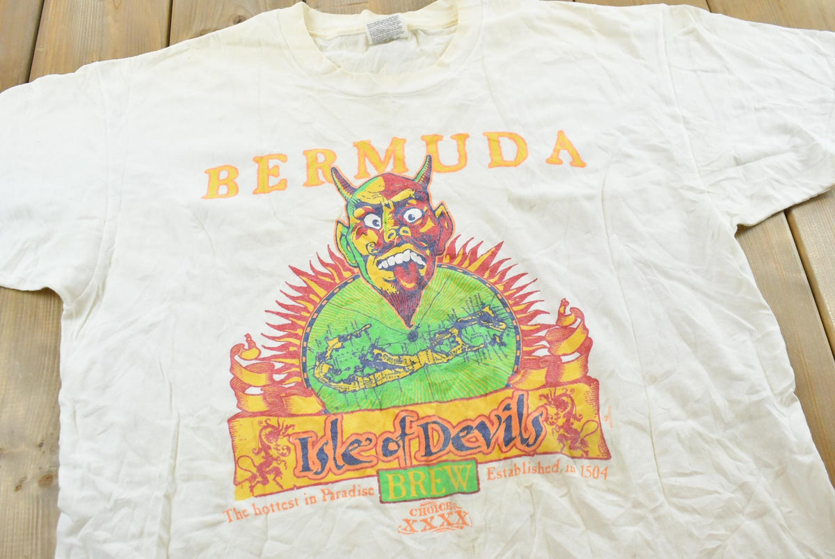 Vintage 1990s Bermuda Isle of Devils Beer Souvenir Graphic Travel T-Shirt Mens XL from propervintagecanada