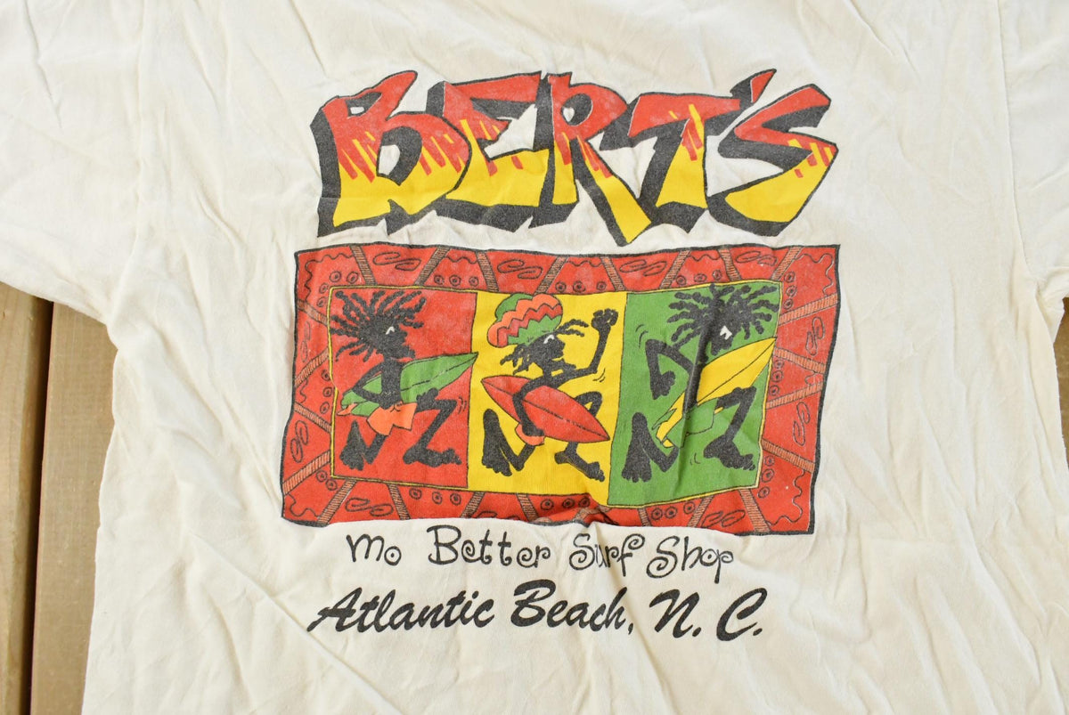 Vintage 1990s Bert's Surf Shop Graphic T-Shirt Men's M from propervintagecanada