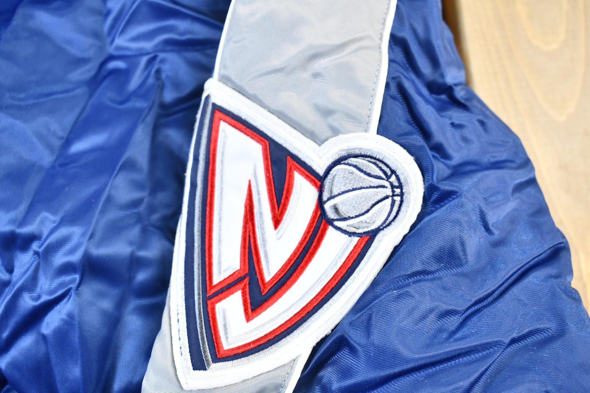 Vintage 1990s Bigman Sports New Jersey Nets NBA Basketball Embroidered Snap Button Satin Bomber Jacket Men's 4XL from propervintagecanada