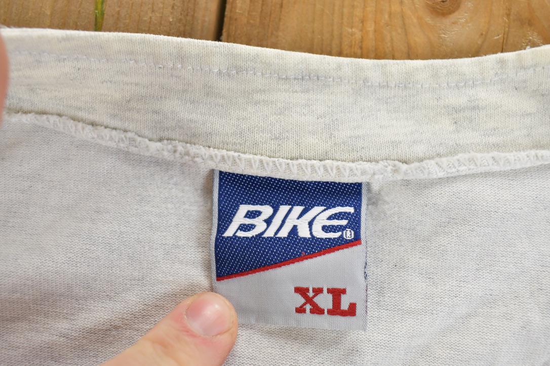 Vintage 1990s Bike KU University Collegiate Baseball Button Up T-Shirt Men's XL from propervintagecanada