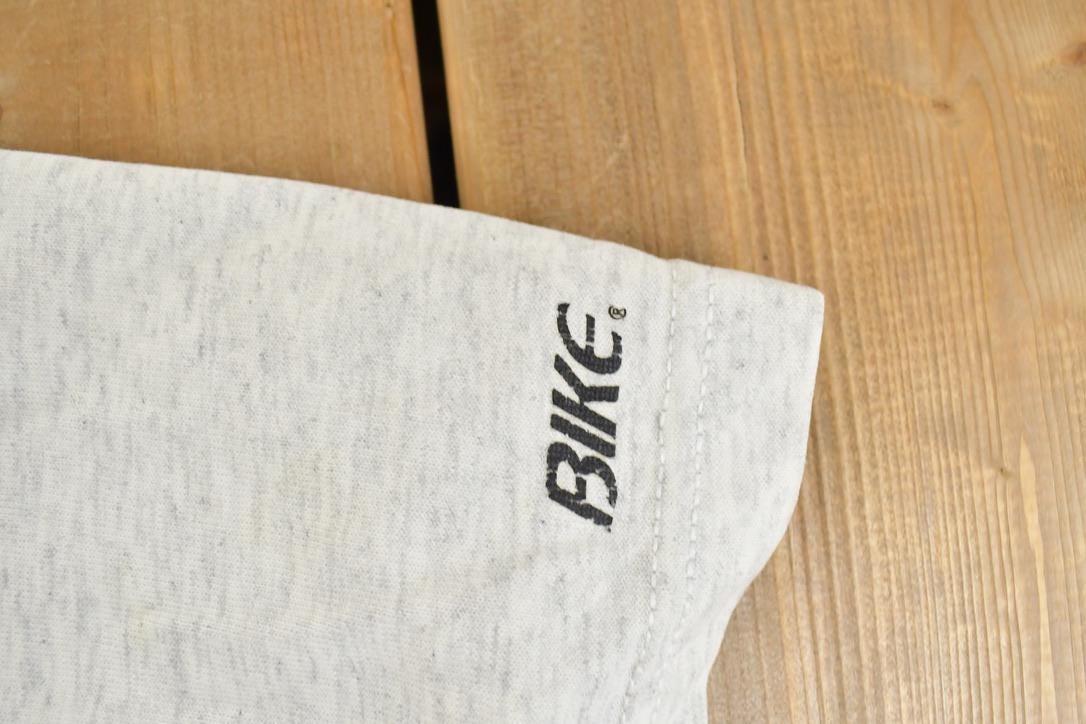 Vintage 1990s Bike KU University Collegiate Baseball Button Up T-Shirt Men's XL from propervintagecanada