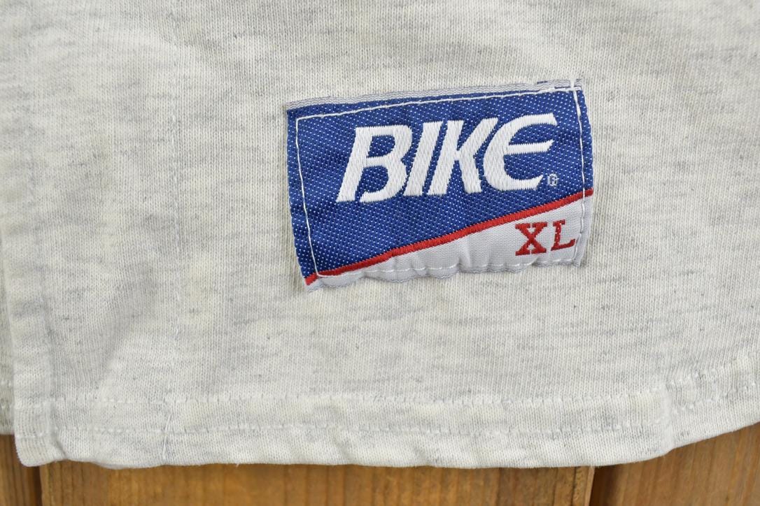 Vintage 1990s Bike KU University Collegiate Baseball Button Up T-Shirt Men's XL from propervintagecanada