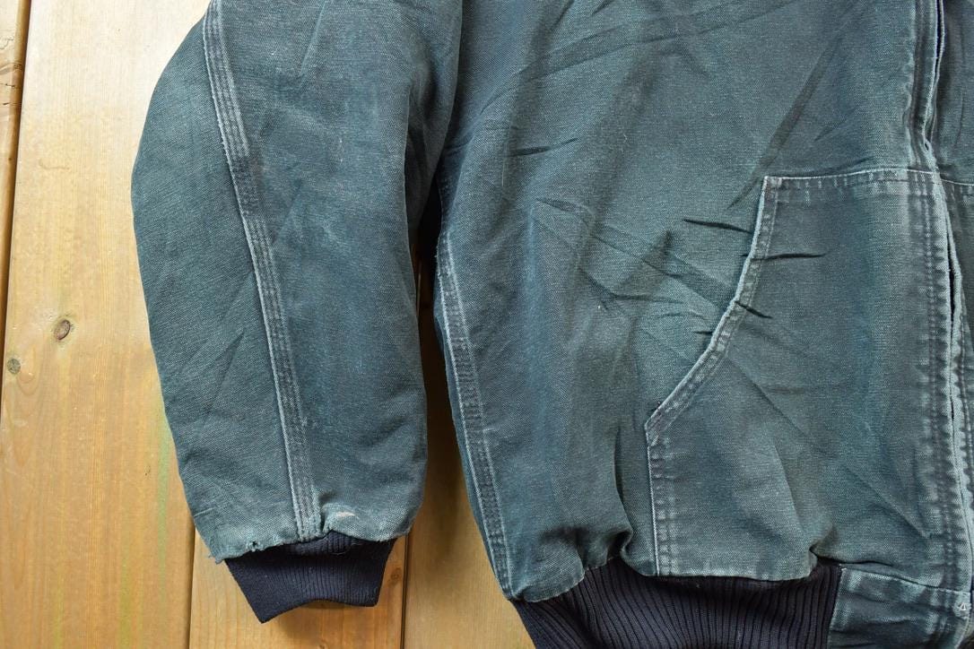 Vintage 1990s Black Carhartt Hooded Jacket Men's XL from propervintagecanada