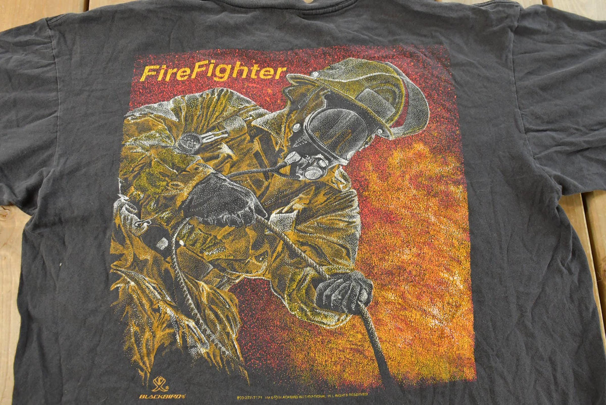 Vintage 1990s Blackbird Firefighters Graphic T-Shirt Men's XL from propervintagecanada