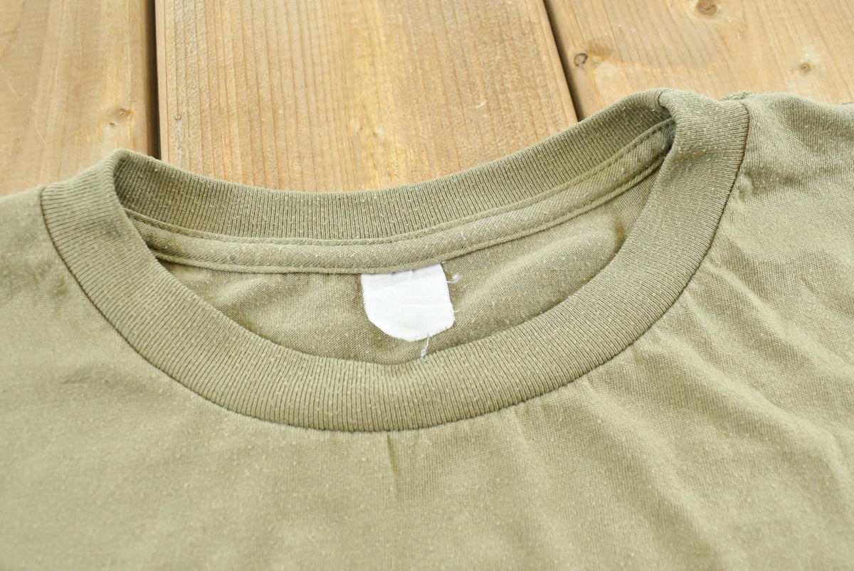 Vintage 1990s Blank Olive Green T-Shirt Men's L from propervintagecanada