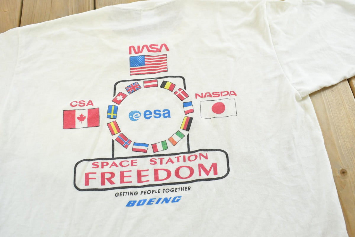 Vintage 1990s Boeing Nasa Space Station Graphic T Shirt Mens L from propervintagecanada