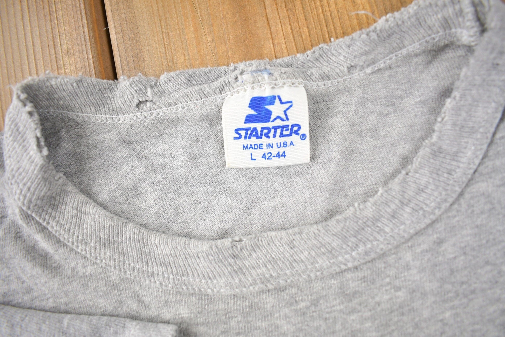Vintage 1990s Boston Celtics NBA Basketball Starter Graphic T-Shirt Made In USA from propervintagecanada