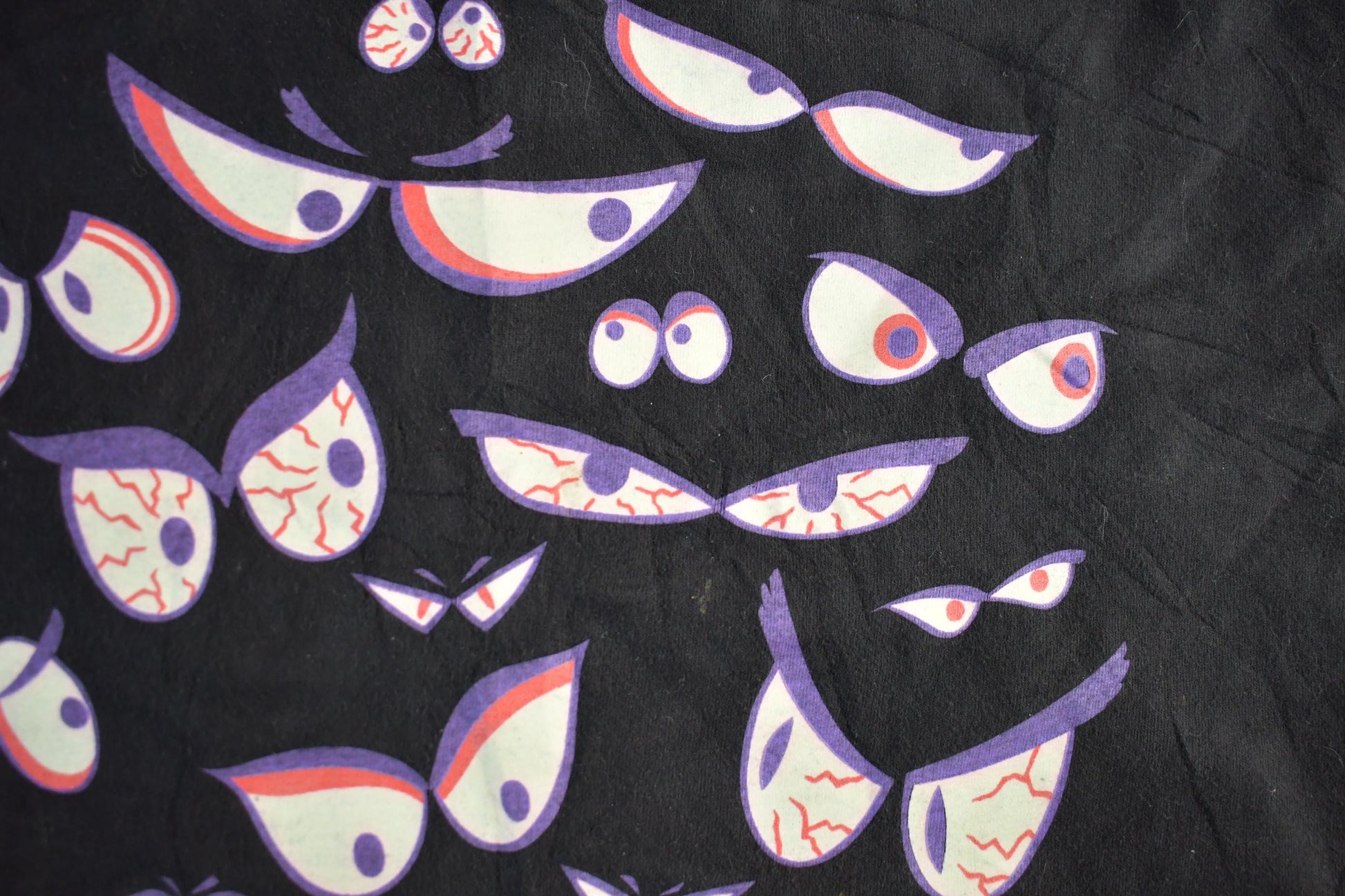 Vintage 1990s Brieland Graphics Glow In The Dark Eyes T-Shirt Men's Large from propervintagecanada