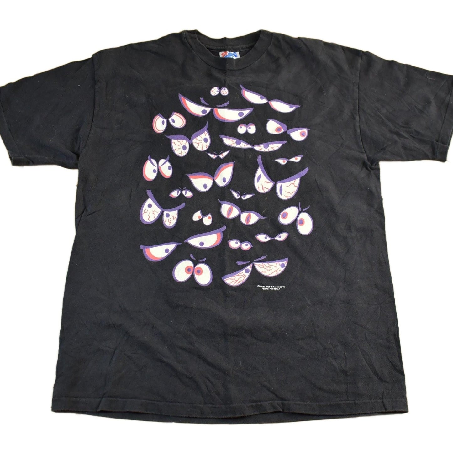 Vintage 1990s Brieland Graphics Glow In The Dark Eyes T-Shirt Men's Large from propervintagecanada