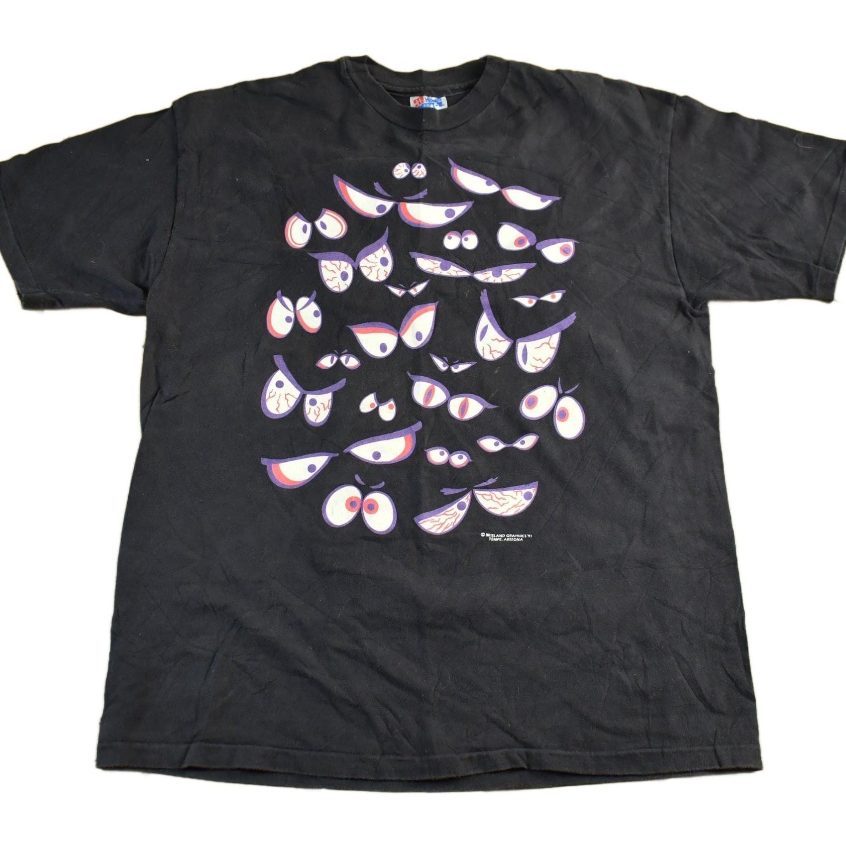 Vintage 1990s Brieland Graphics Glow In The Dark Eyes T-Shirt Men's Large from propervintagecanada