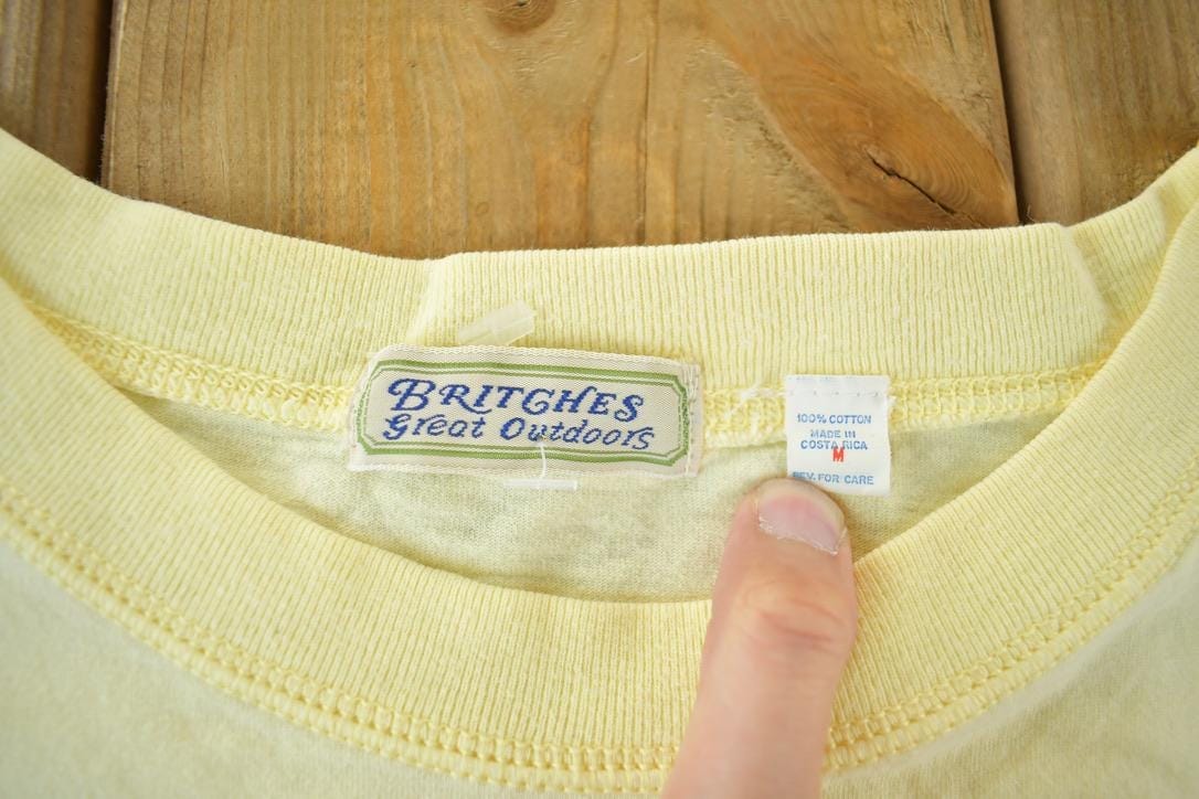Vintage 1990s Britches Great Outdoors Blank Graphic T-Shirt Men's Medium from propervintagecanada