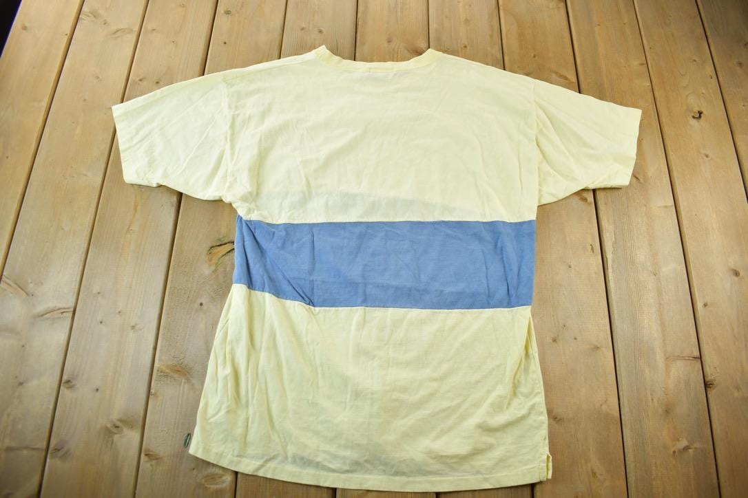Vintage 1990s Britches Great Outdoors Blank Graphic T-Shirt Men's Medium from propervintagecanada