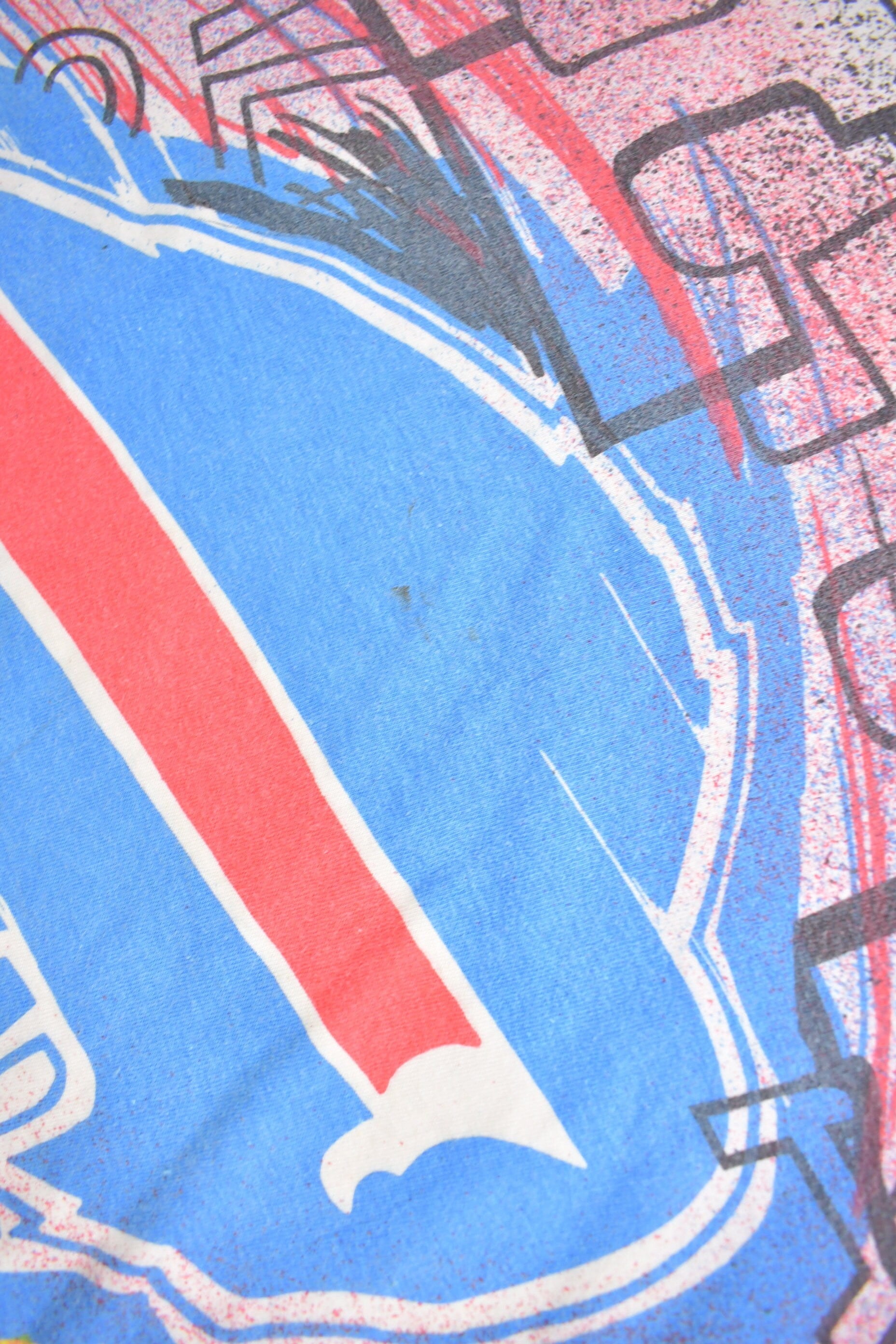 Vintage 1990s Buffalo Bills NFL All Over Print T-Shirt Men's Large from propervintagecanada