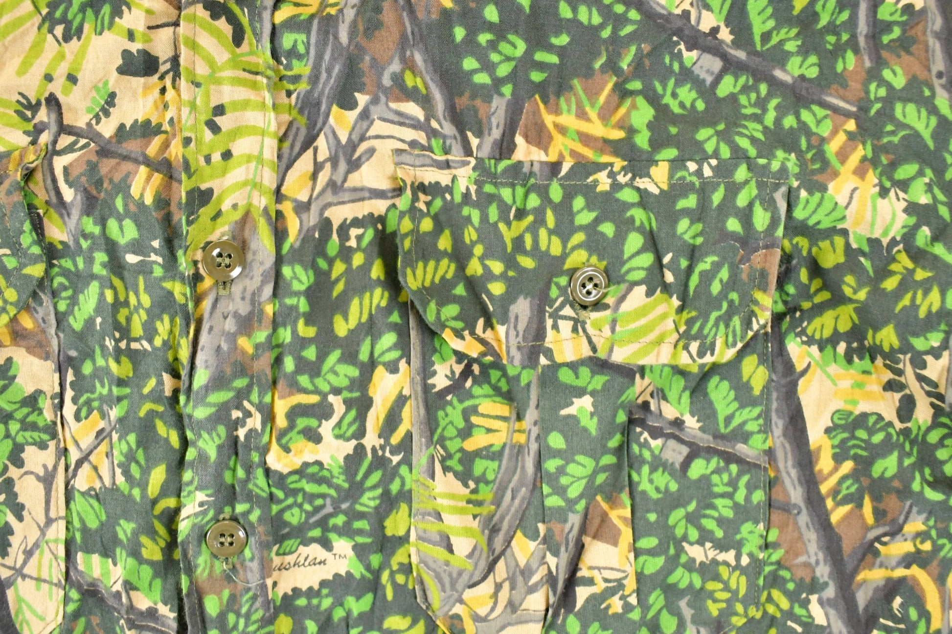 Vintage 1990s Bushlan AOP Woodland Camo Button Up Shirt Mens L from propervintagecanada