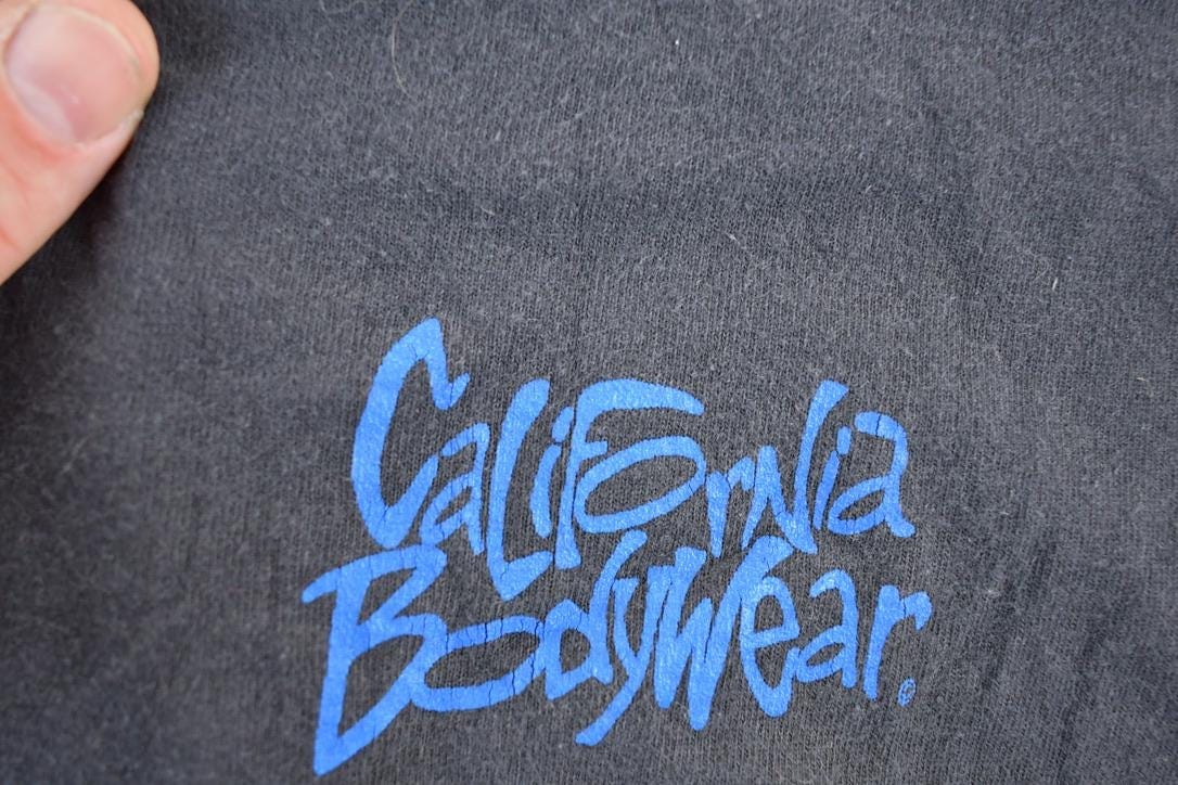 Vintage 1990s California Bodywear Souvenir Single Stitch Graphic Print T-Shirt Made In USA Men's XL from propervintagecanada