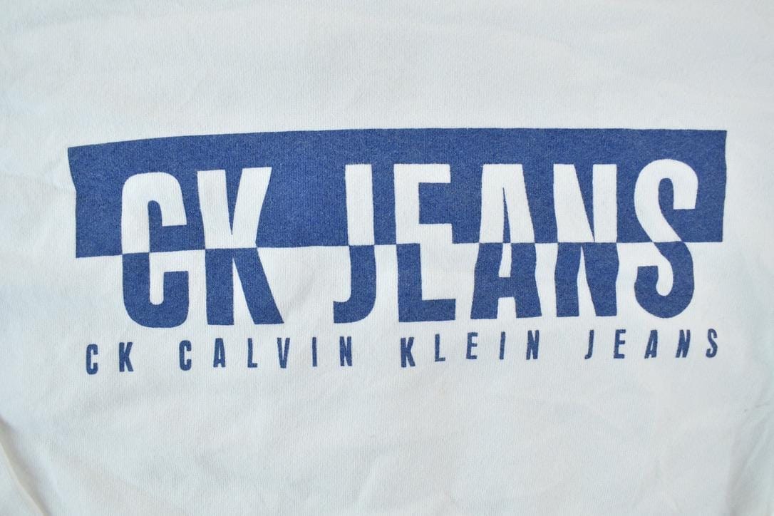 Vintage 1990s Calvin Klein Jeans Crew Neck Sweatshirt Made In USA Men's XL from propervintagecanada