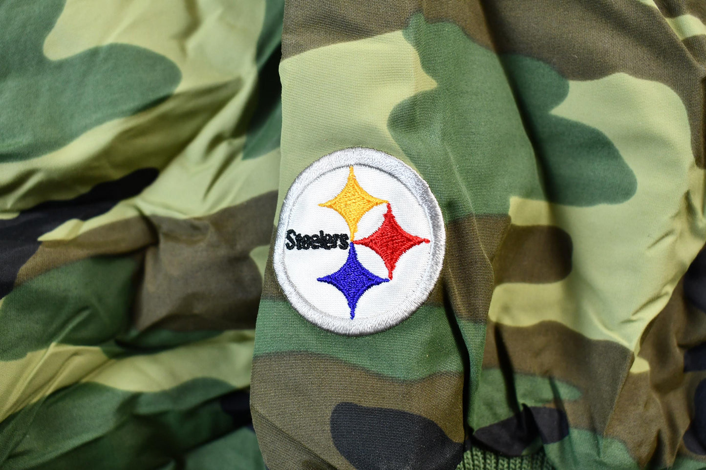Vintage 1990s Camo Pittsburgh Steelers NFL Football Hooded Puffer Jacket Men's 3XL from propervintagecanada
