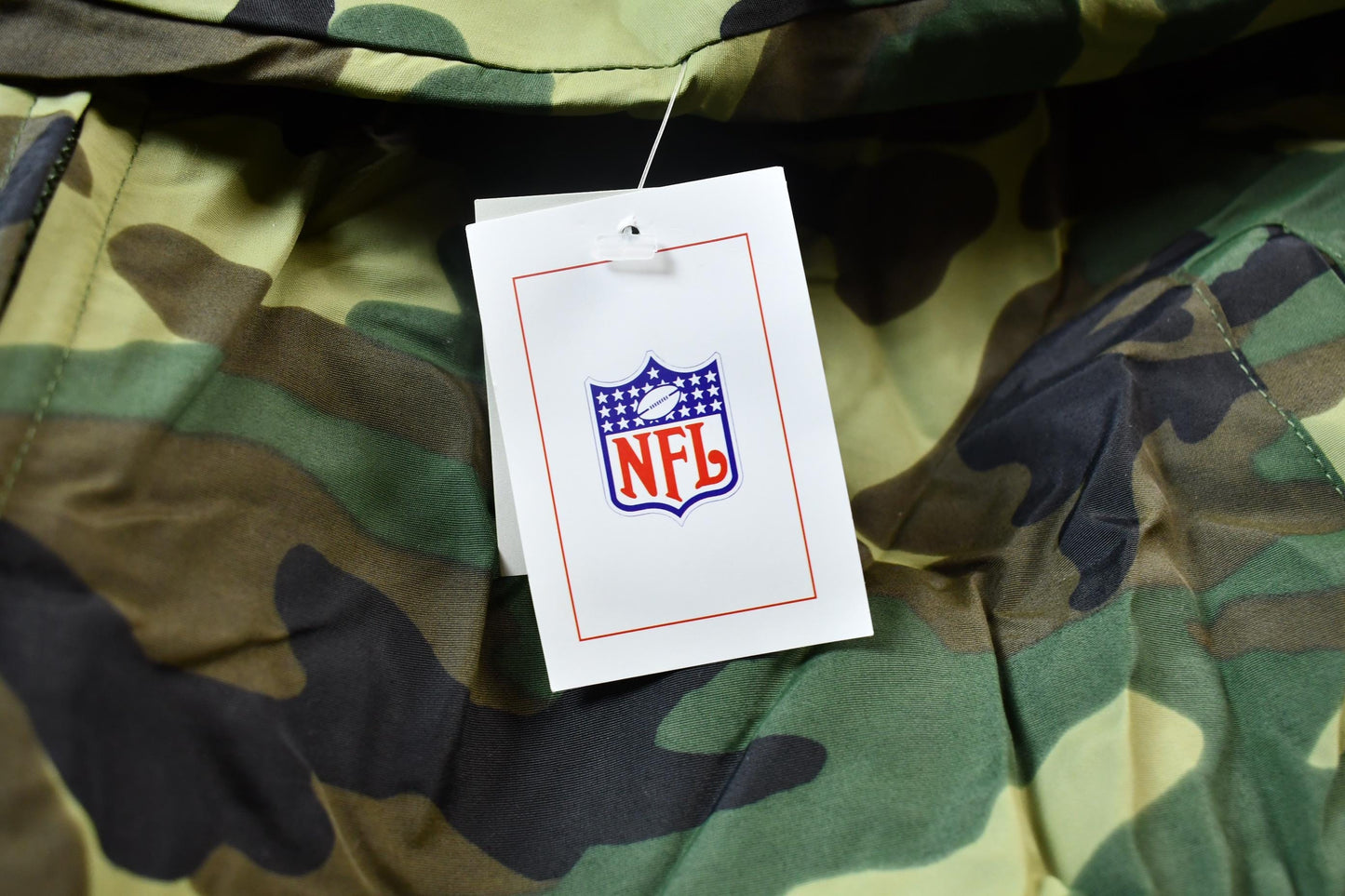 Vintage 1990s Camo Raiders NFL Football Hooded Puffer Jacket Men's 3XL from propervintagecanada