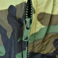 Vintage 1990s Camo Raiders NFL Football Hooded Puffer Jacket Men's 3XL from propervintagecanada