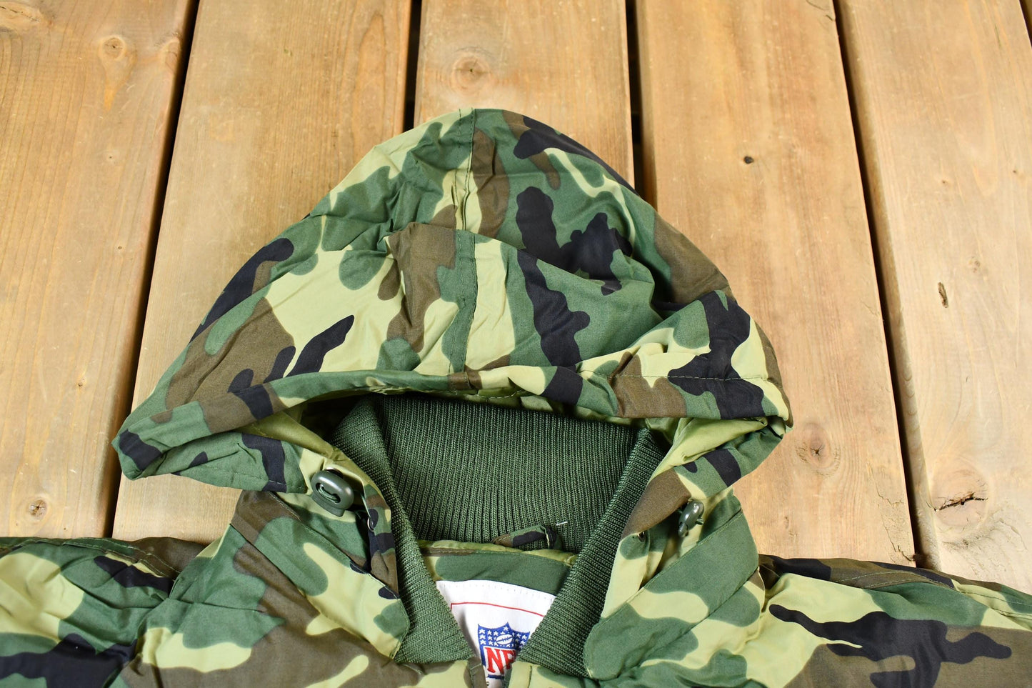 Vintage 1990s Camo Raiders NFL Football Hooded Puffer Jacket Men's 3XL from propervintagecanada