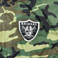 Vintage 1990s Camo Raiders NFL Football Hooded Puffer Jacket Men's 3XL from propervintagecanada