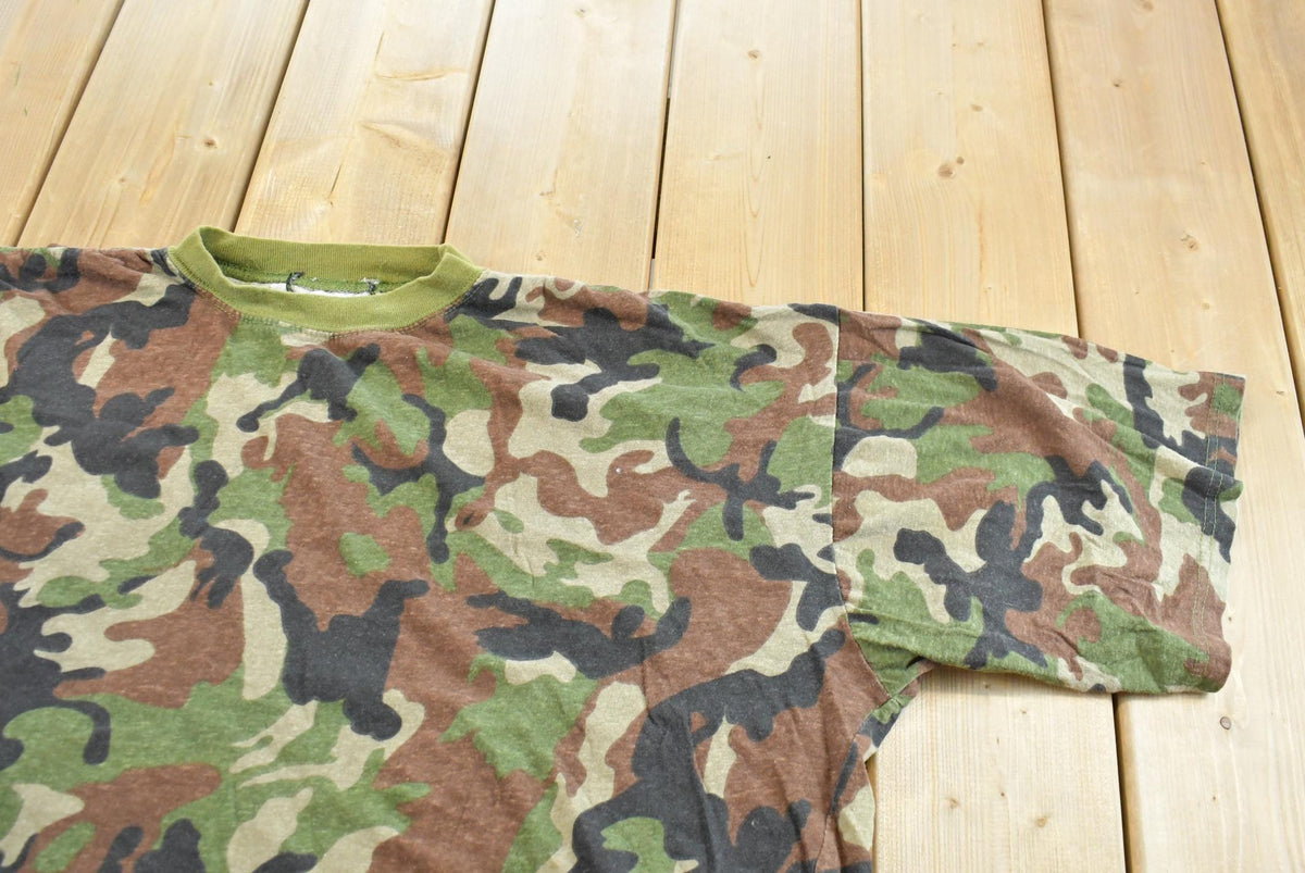 Vintage 1990s Camo T-Shirt Men's 2XL from propervintagecanada