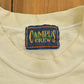 Vintage 1990s Campus Crew Wear University Collegiate T-Shirt Men's XL from propervintagecanada