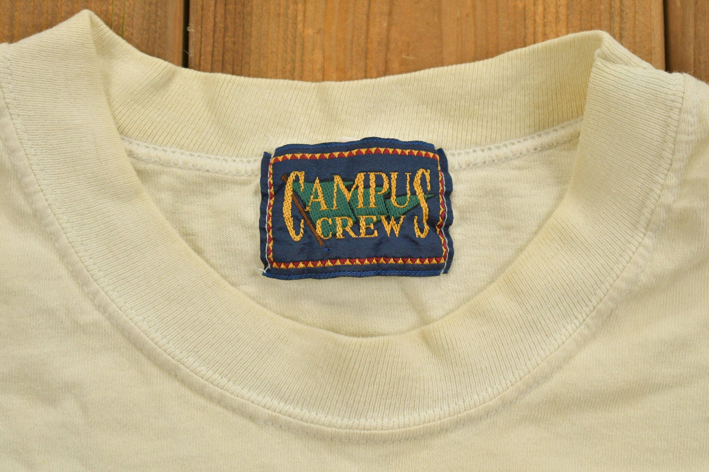 Vintage 1990s Campus Crew Wear University Collegiate T-Shirt Men's XL from propervintagecanada