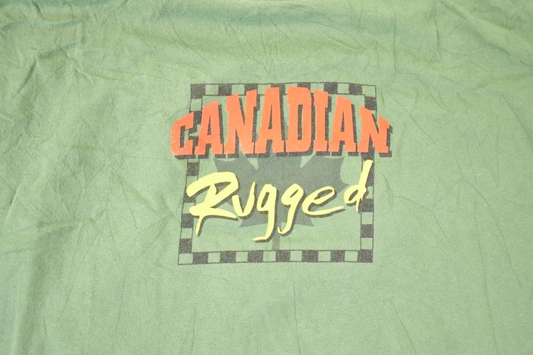 Vintage 1990s Canadian Rugged Daffy Duck Looney Tunes Fishing Souvenir T-Shirt Men's XL from propervintagecanada