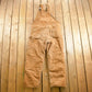 Vintage 1990s Carhartt Beige Double Knee Canvas Quilted Overalls Men's 38 x 30.5 from propervintagecanada