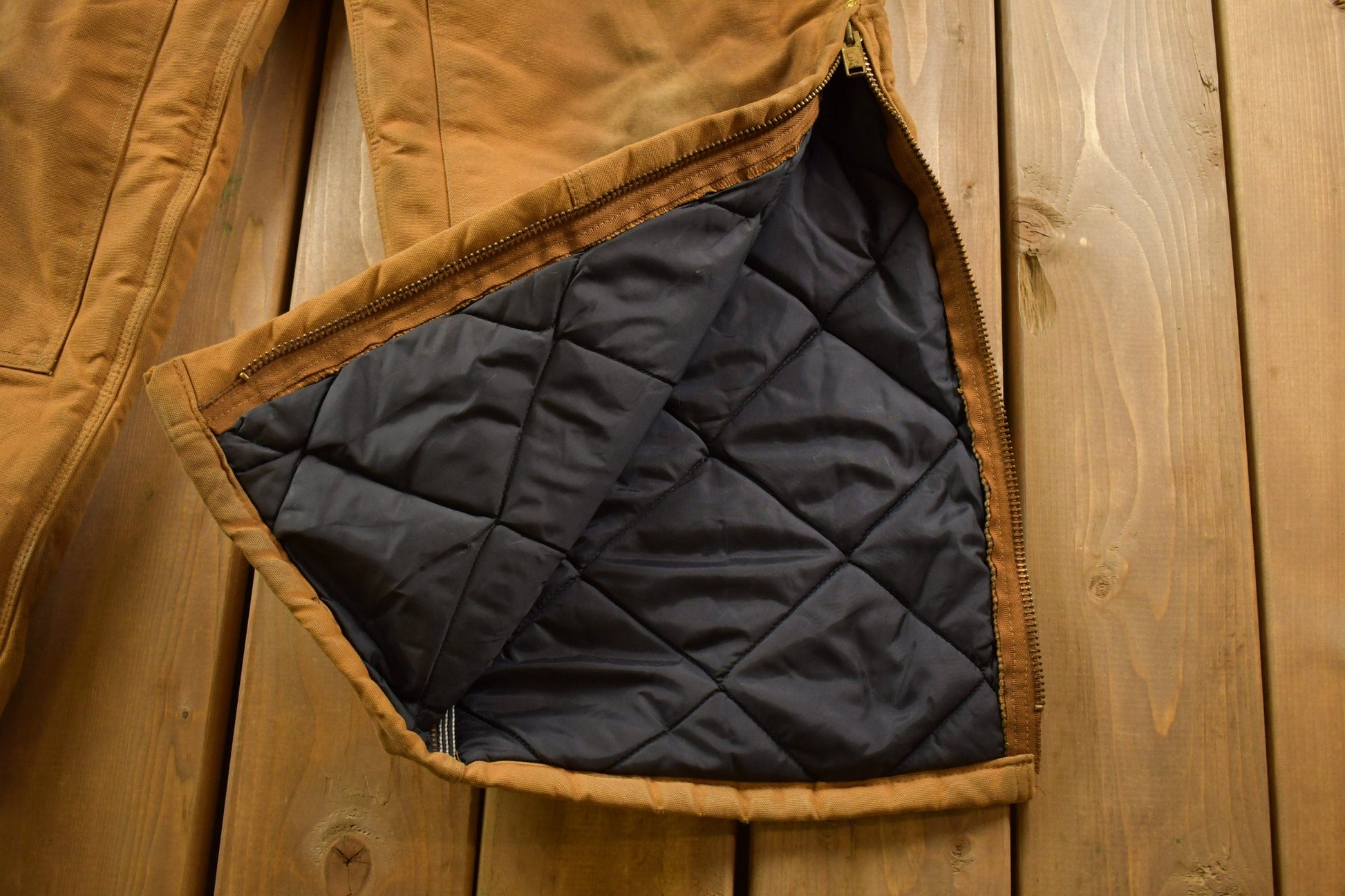 Vintage 1990s Carhartt Beige Double Knee Canvas Quilted Overalls Men's 44 x 30 from propervintagecanada