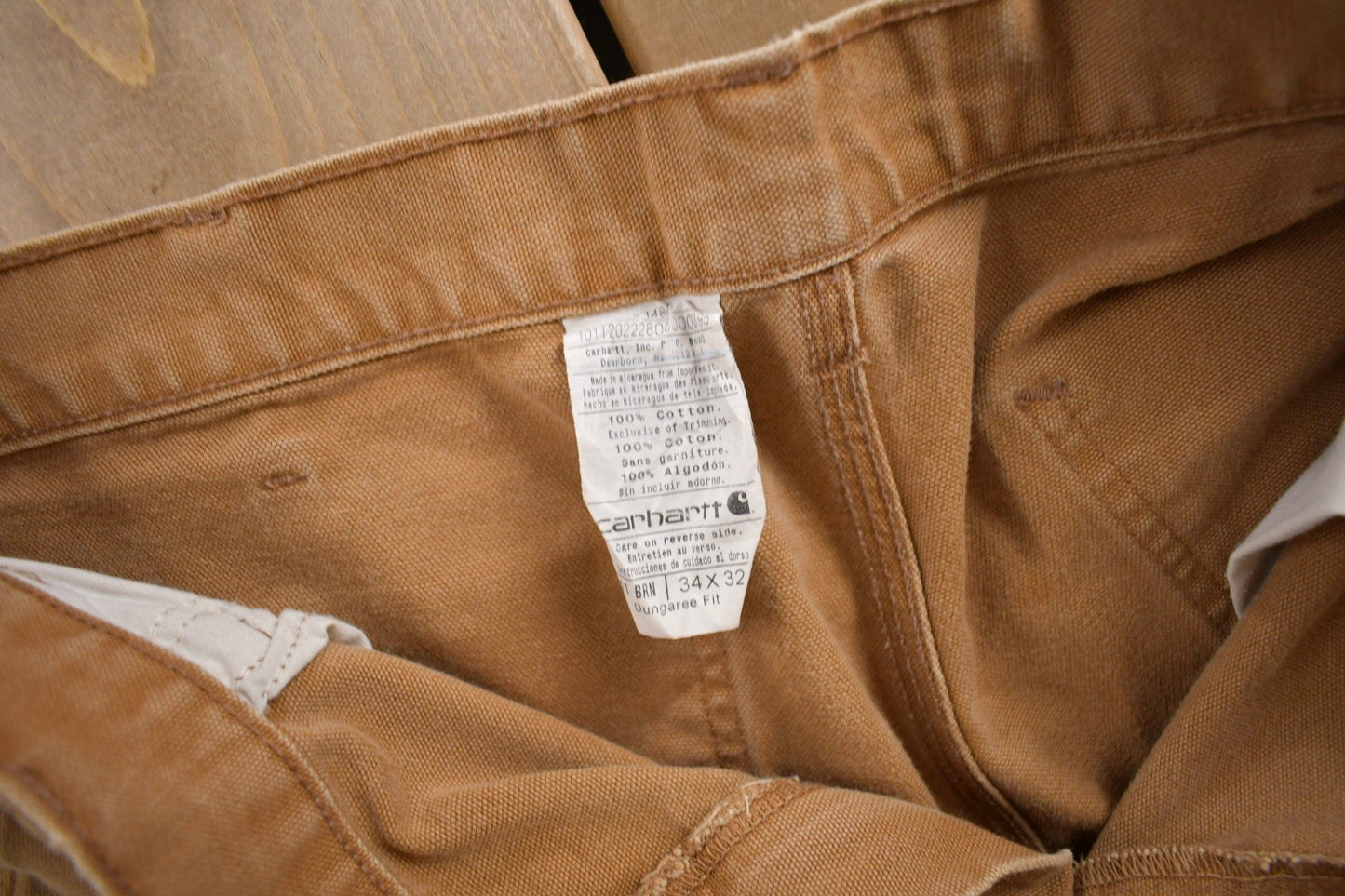 Vintage 1990s Carhartt Beige Work Pants Men's 34 x 30 from propervintagecanada