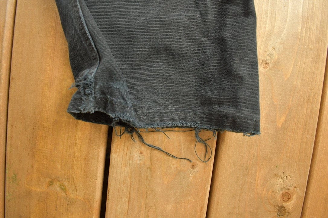Vintage 1990s Carhartt Black Canvas Double Knee Overalls Men's 44 x 32 from propervintagecanada