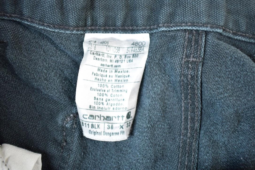 Vintage 1990s Carhartt Black Denim Work Jeans Men's 38 x 32 from propervintagecanada