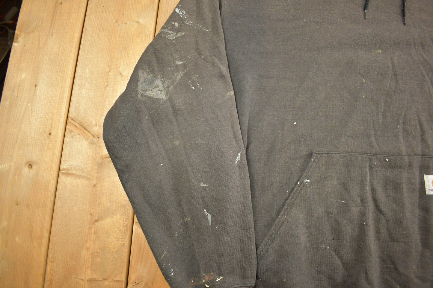 Vintage 1990s Carhartt Black Paint Splattered Hoodie Men's 2XL from propervintagecanada