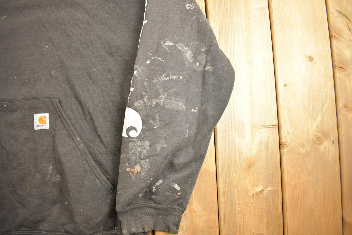 Vintage 1990s Carhartt Black Paint Splattered Hoodie Men's 2XL from propervintagecanada