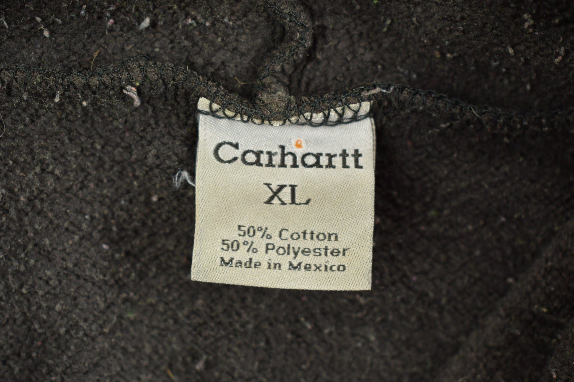 Vintage 1990s Carhartt Black Paint Splattered Hoodie Men's 2XL from propervintagecanada