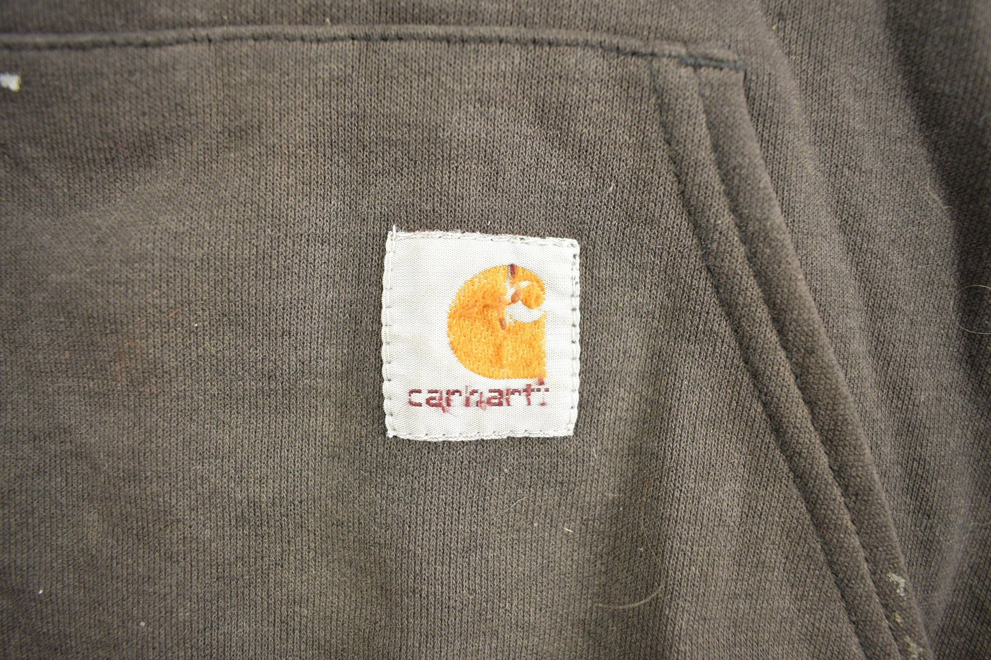 Vintage 1990s Carhartt Black Paint Splattered Hoodie Men's 2XL from propervintagecanada