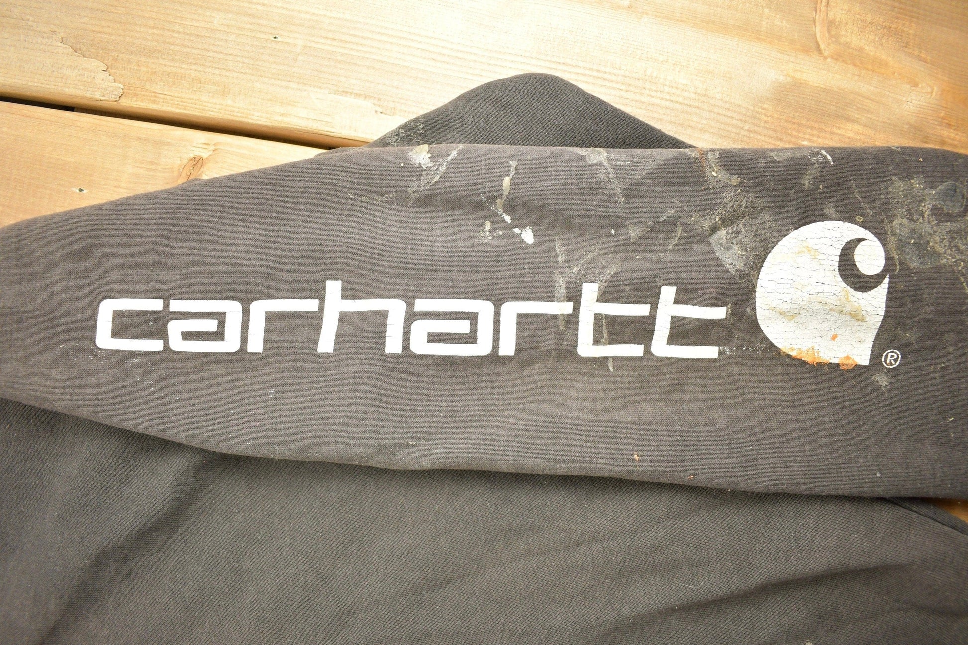 Vintage 1990s Carhartt Black Paint Splattered Hoodie Men's 2XL from propervintagecanada
