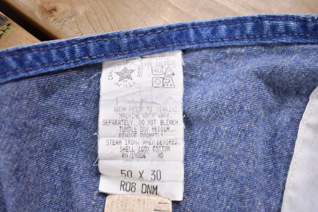 Vintage 1990s Carhartt Blue Denim Overalls Men's 50 x 28 from propervintagecanada