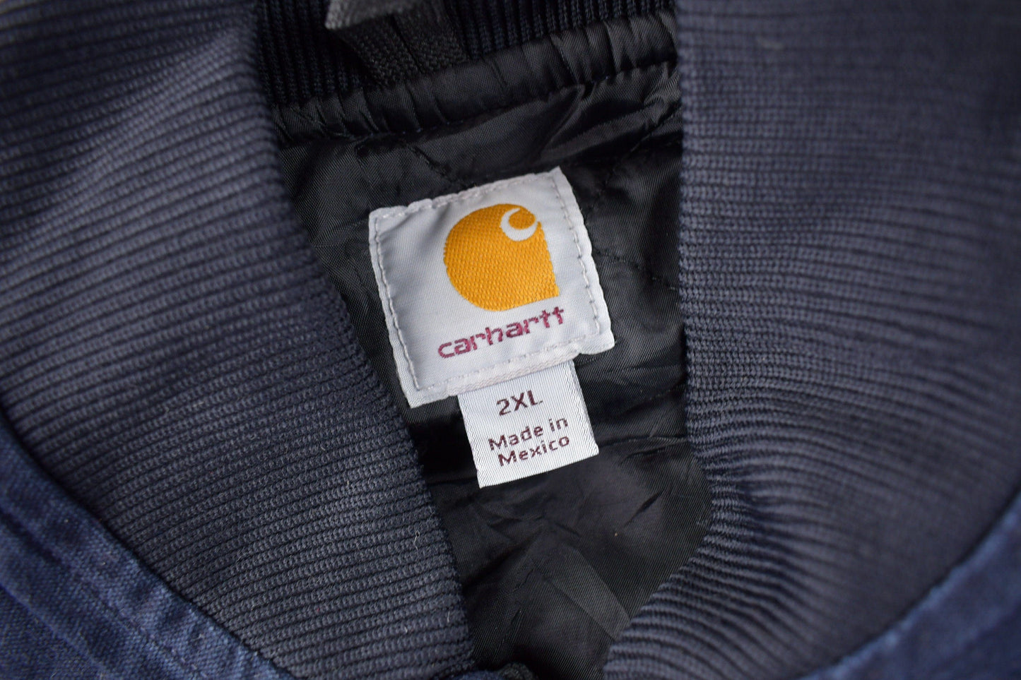 Vintage 1990s Carhartt Blue Embroidered Quilted Work Vest Men's 2XL from propervintagecanada