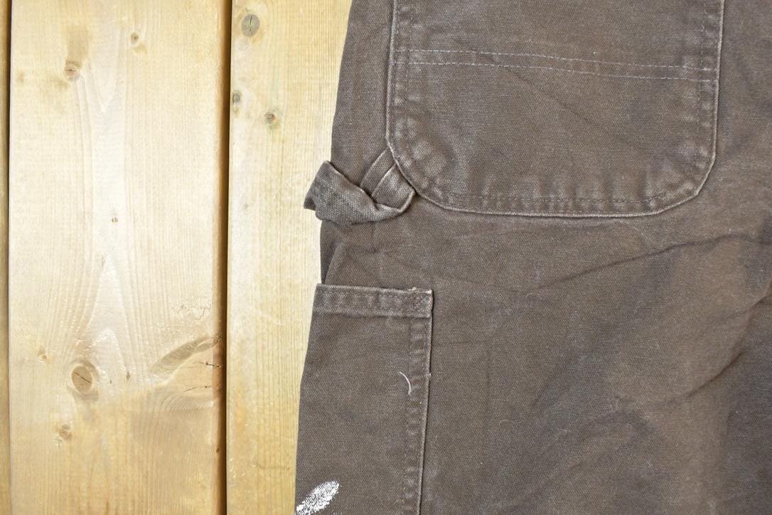 Vintage 1990s Carhartt Brown Denim Work Pants Men's 38 x 30 from propervintagecanada