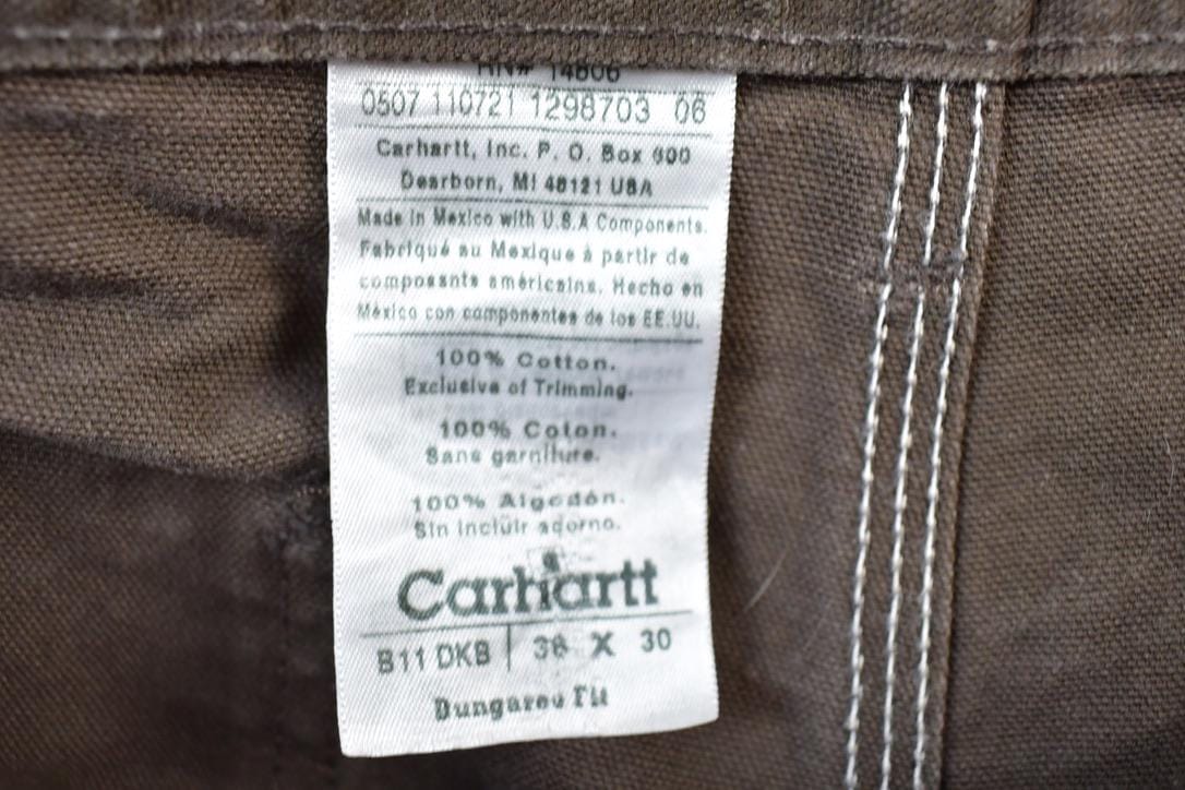 Vintage 1990s Carhartt Brown Denim Work Pants Men's 38 x 30 from propervintagecanada