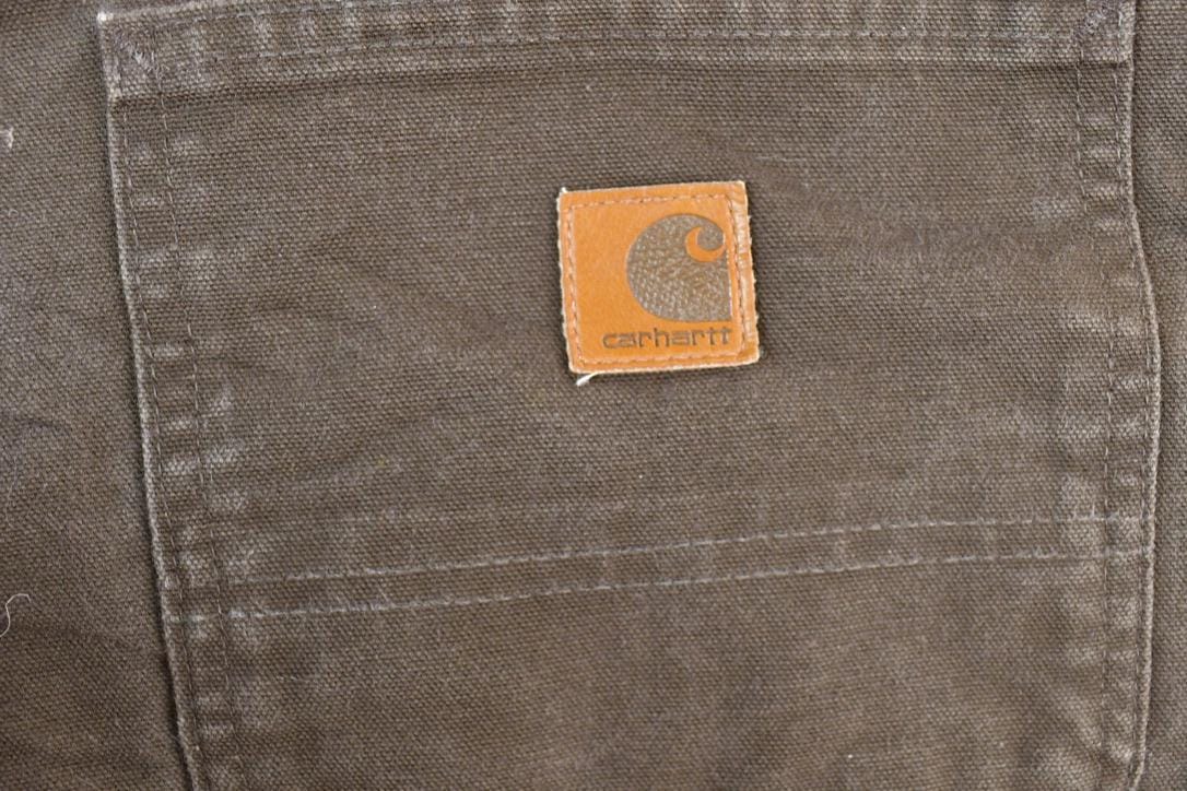 Vintage 1990s Carhartt Brown Denim Work Pants Men's 38 x 30 from propervintagecanada