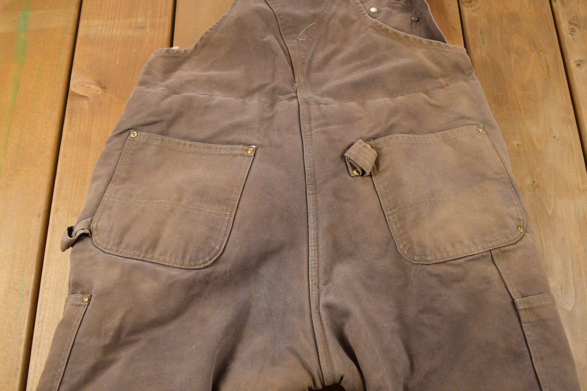Vintage 1990s Carhartt Brown Double Knee Canvas Quilted Overalls Men's 36 x 28 from propervintagecanada