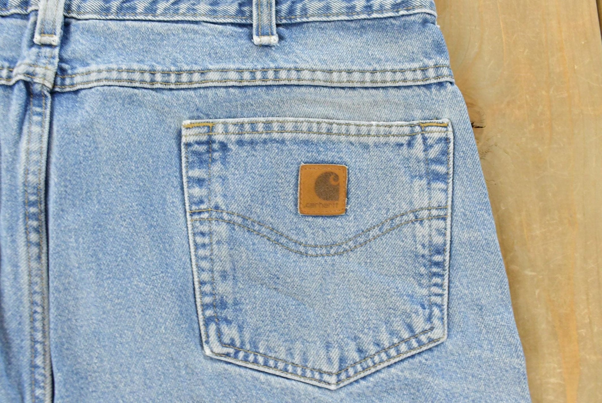 Vintage 1990s Carhartt Carpenter Distressed Denim Jeans Men's 38 x 32 from propervintagecanada