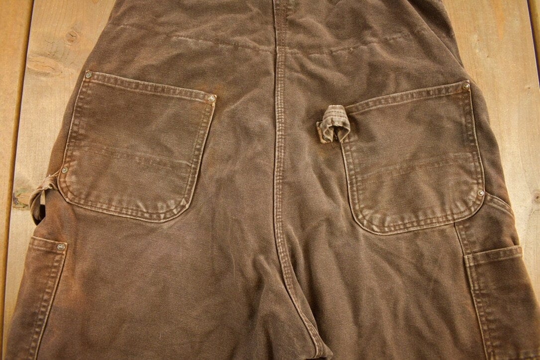 Vintage 1990s Carhartt Chocolate Brown Double Knee Canvas Overalls Men's 38 x 30 from propervintagecanada