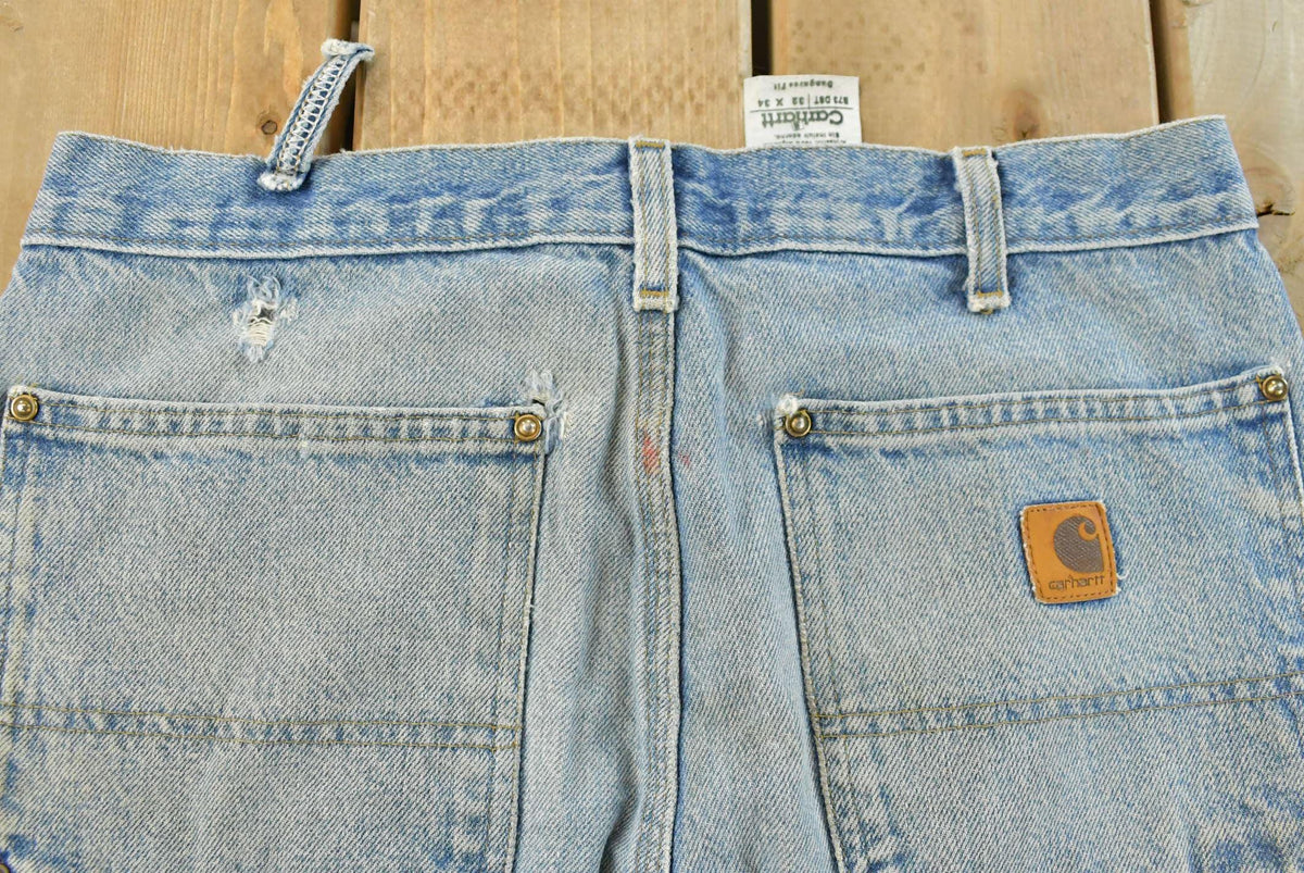 Vintage 1990s Carhartt Distressed Double Knee Denim Work Jeans Men's 31 x 33 from propervintagecanada