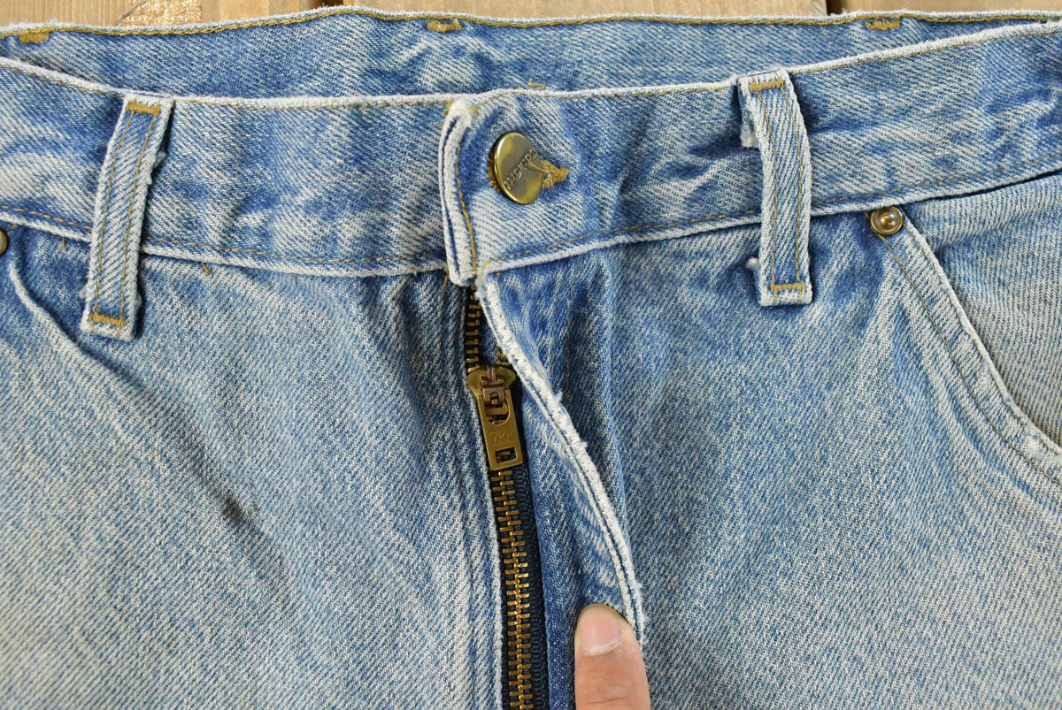 Vintage 1990s Carhartt Distressed Double Knee Denim Work Jeans Men's 31 x 33 from propervintagecanada